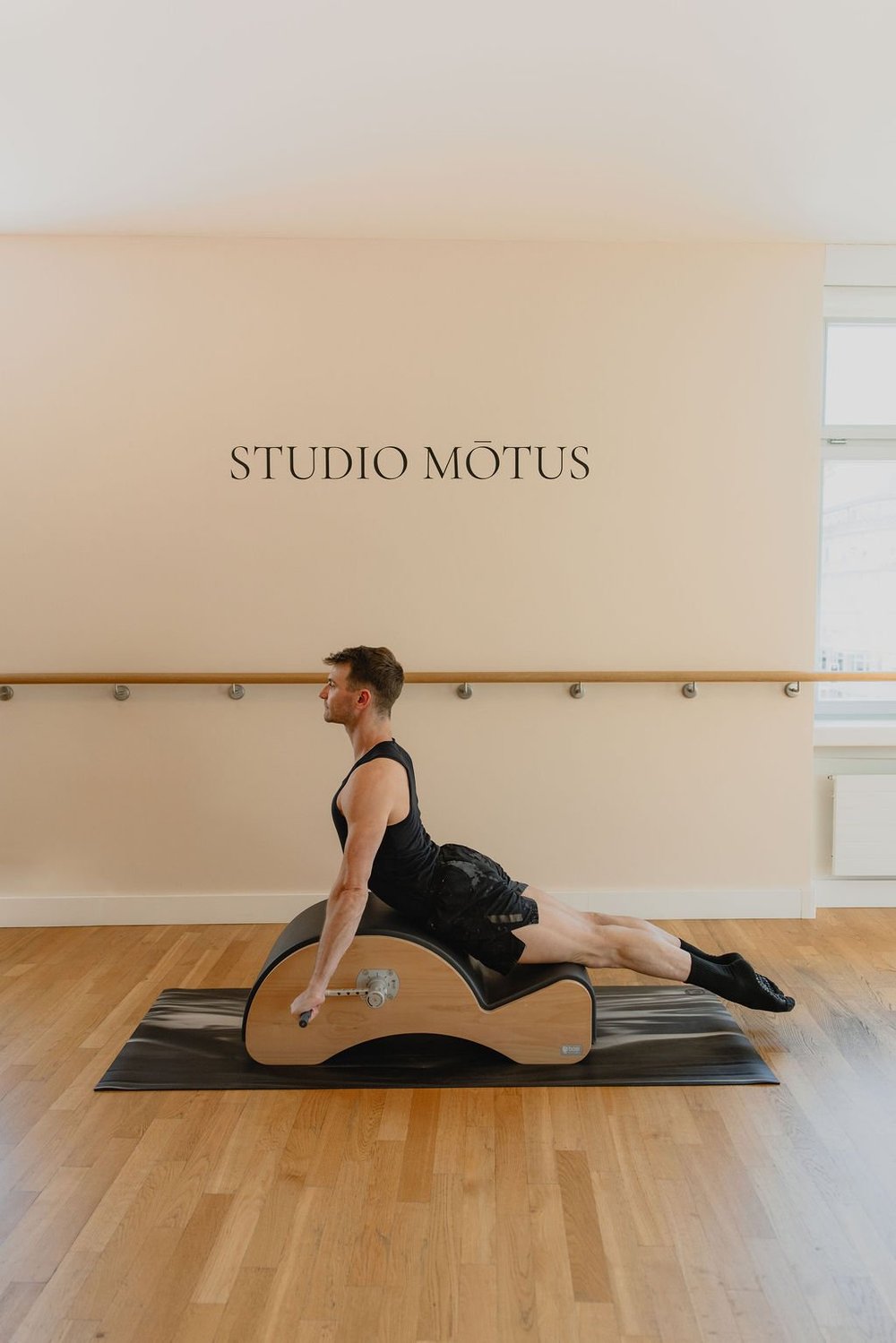 Pilates extension practice on the Spine Corrector at Studio Mōtus