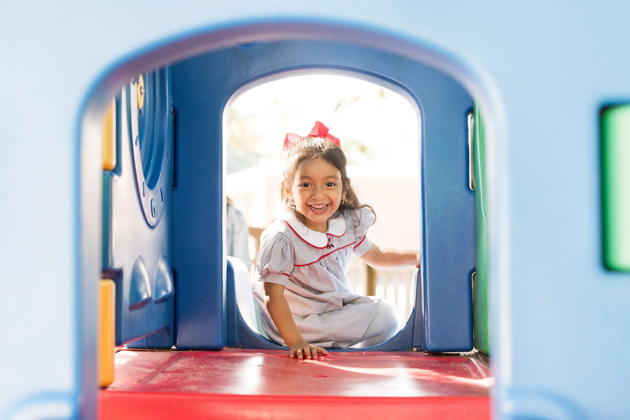 Preschool student playing at St. Pius X