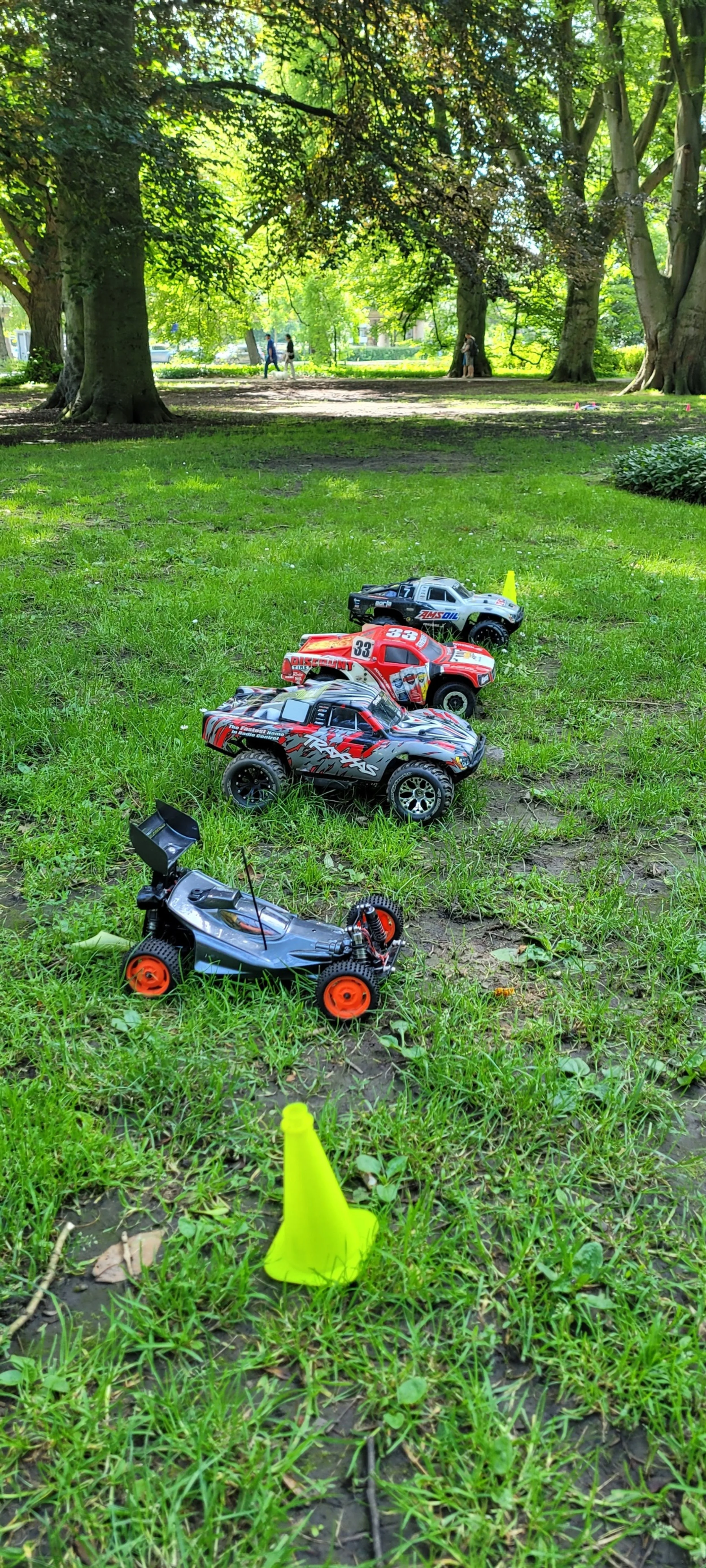 Students working on RC cars in the pits