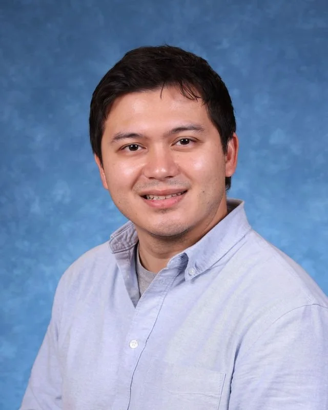 Headshot of H. Perdomo, Assistant Principal, with a professional demeanor.
