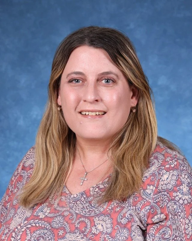 Headshot of H. Perdomo, Assistant Principal, with a professional demeanor.
