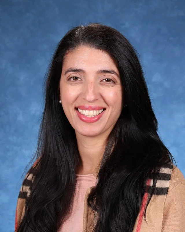 Headshot of H. Perdomo, Assistant Principal, with a professional demeanor.