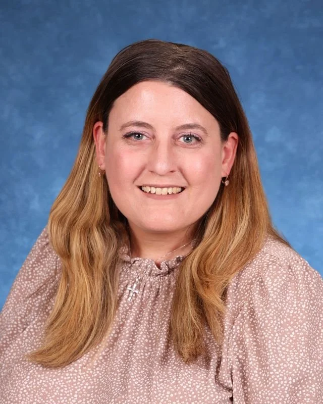 Headshot of H. Perdomo, Assistant Principal, with a professional demeanor.