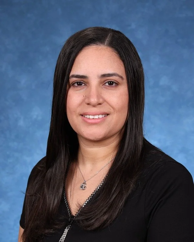 Headshot of Shehata, with a professional demeanor.