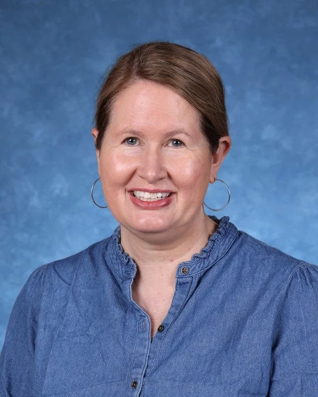 Portrait of Myrna Gonzalez Rojas, Principal/Directora, smiling against a neutral background.