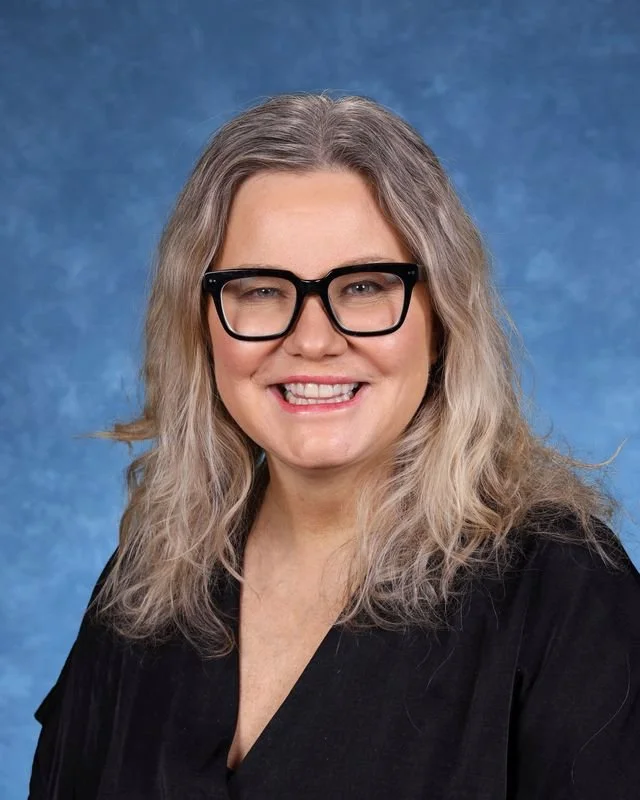 Portrait of Myrna Gonzalez Rojas, Principal/Directora, smiling against a neutral background.