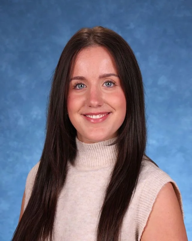Portrait of Myrna Gonzalez Rojas, Principal/Directora, smiling against a neutral background.
