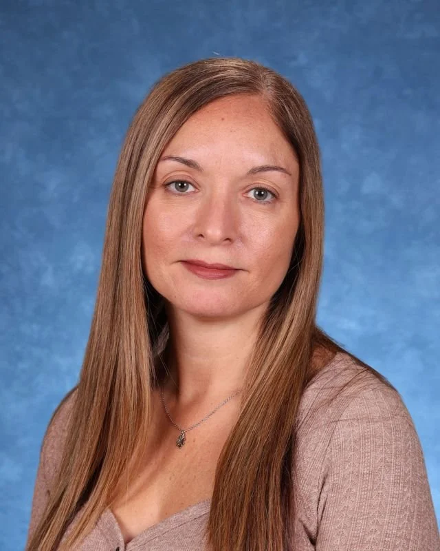 Portrait of Myrna Gonzalez Rojas, Principal/Directora, smiling against a neutral background.