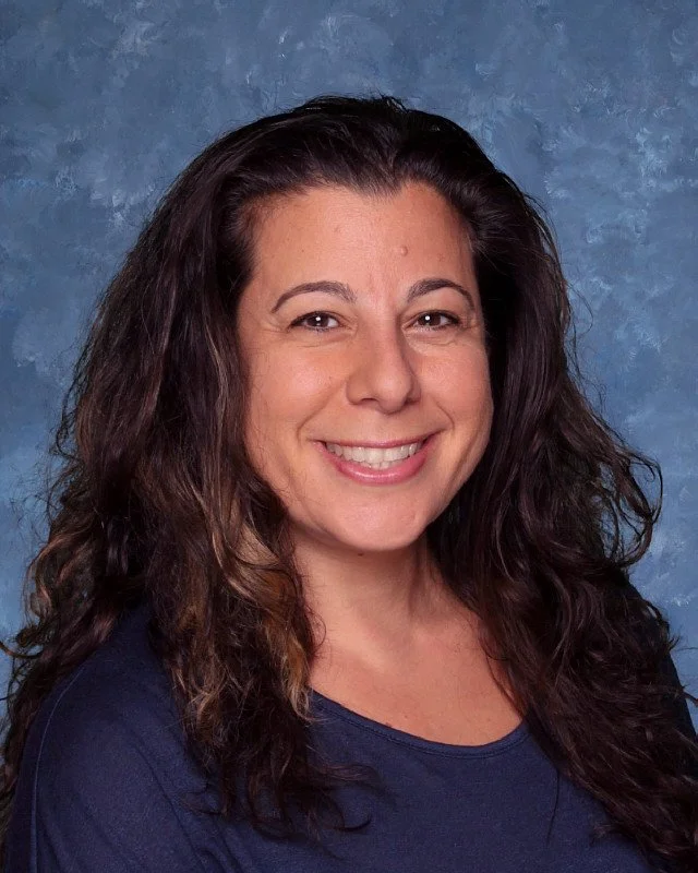 Headshot of H. Perdomo, Assistant Principal, with a professional demeanor.