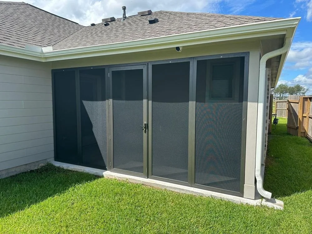 Patio enclosure with security screens