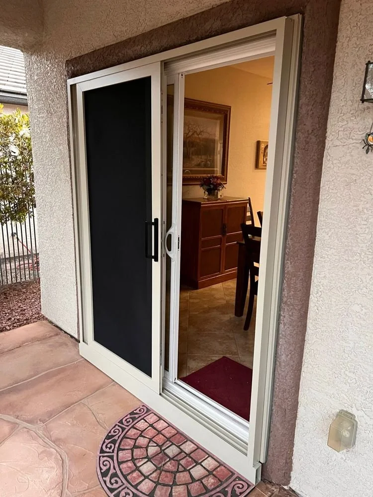 Sliding security screen door with the glass door open