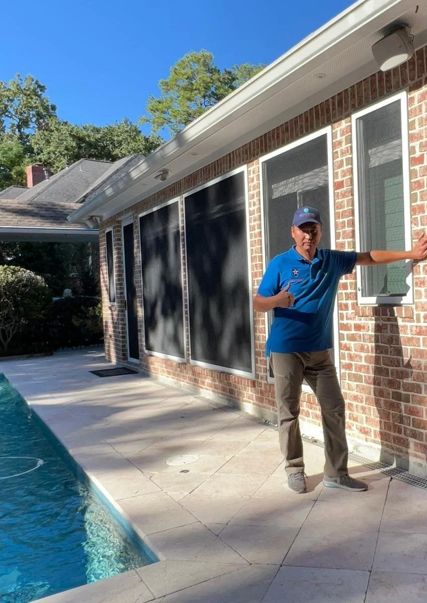 Max Zhussipbek, owner of American Security Screens Houston, at a finished installation