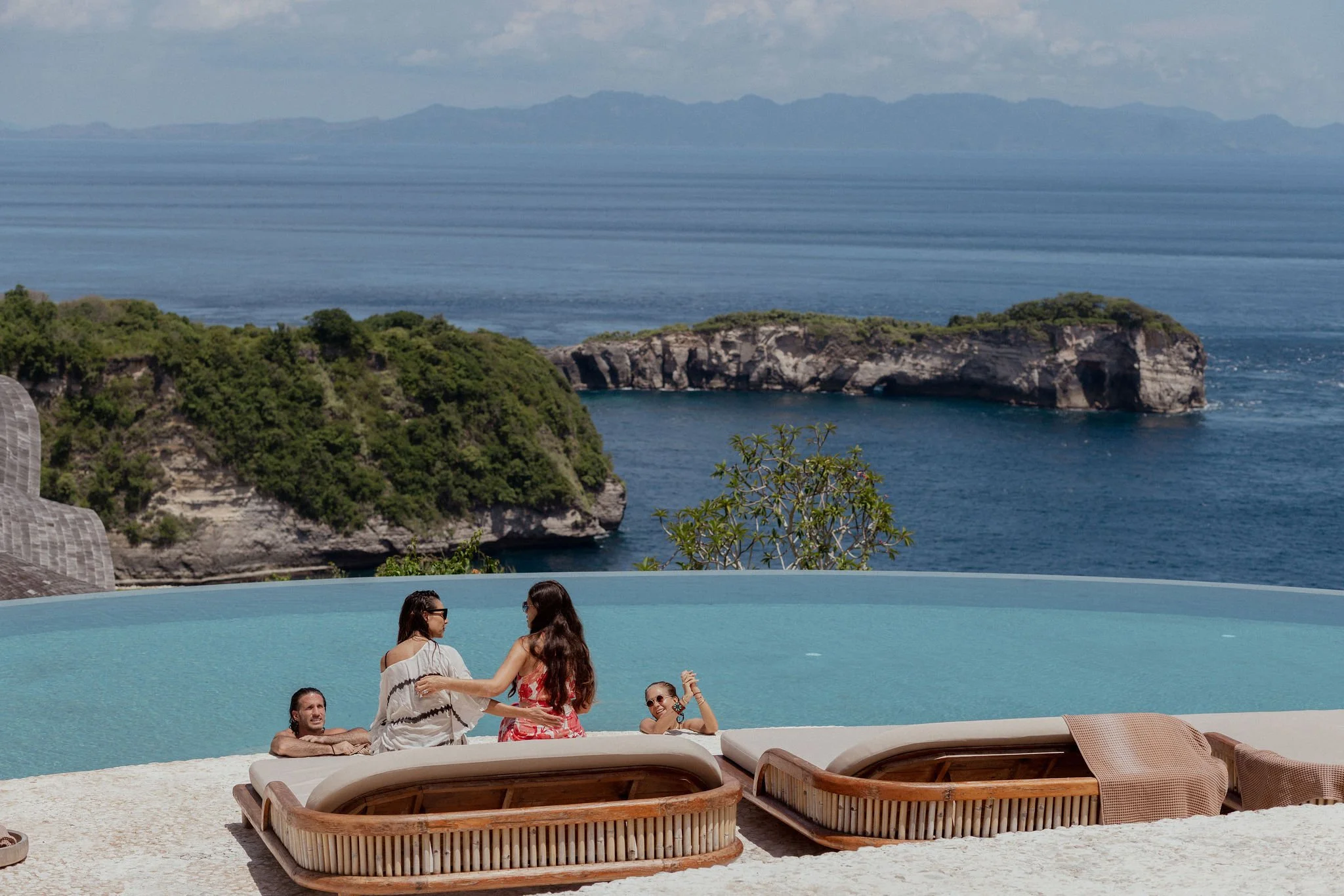 Guests by the pool at Intaaya