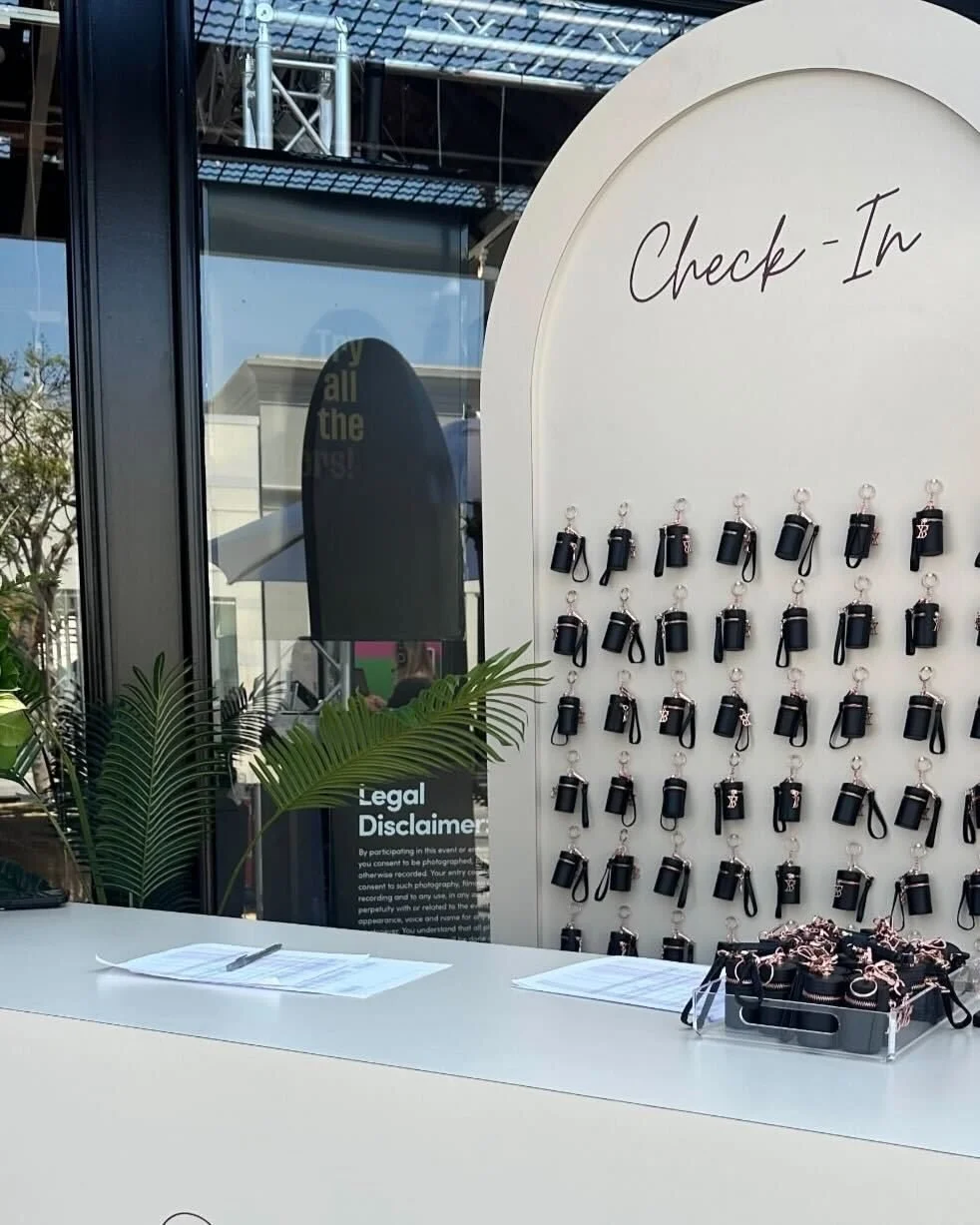 The check-in wall of lip oil bag charms