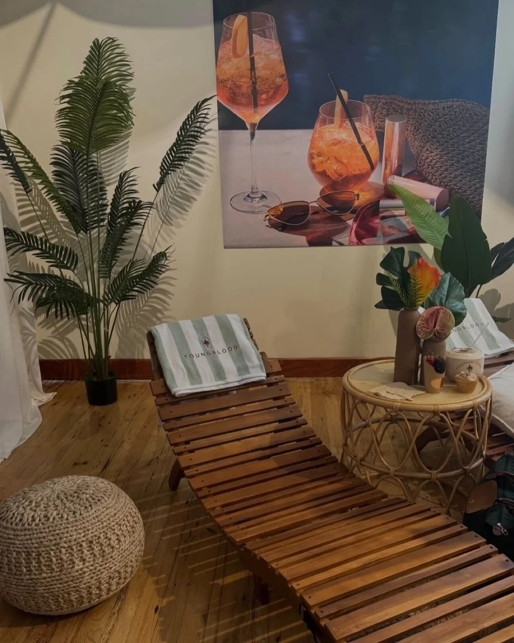 A cabana lounger with a striped Youngblood towel
