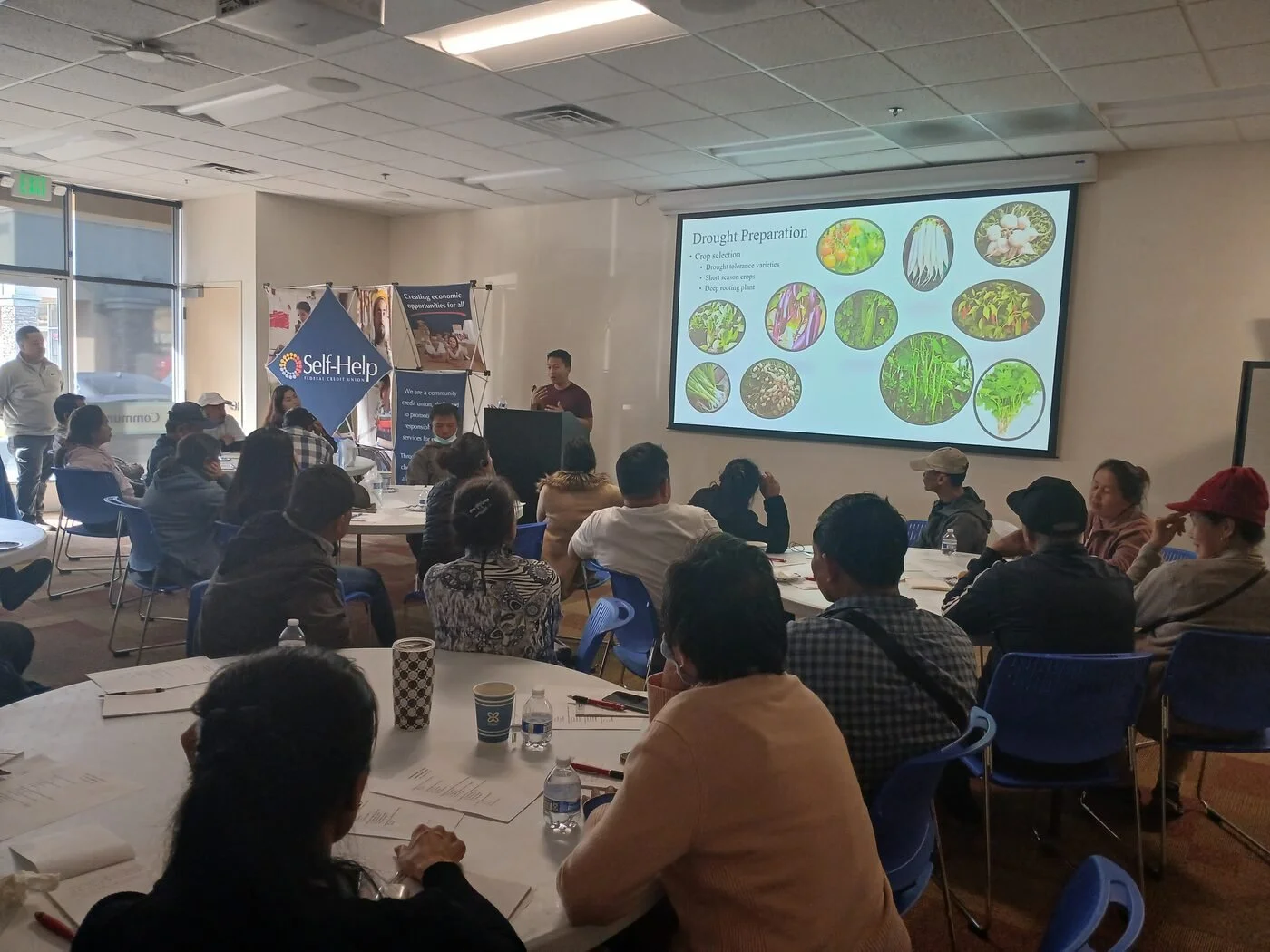 Producers at a drought preparation and soil health workshop