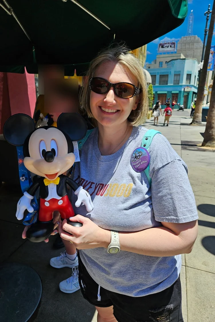 Kara Hull holding a Mickey Mouse sipper at Hollywood Studios