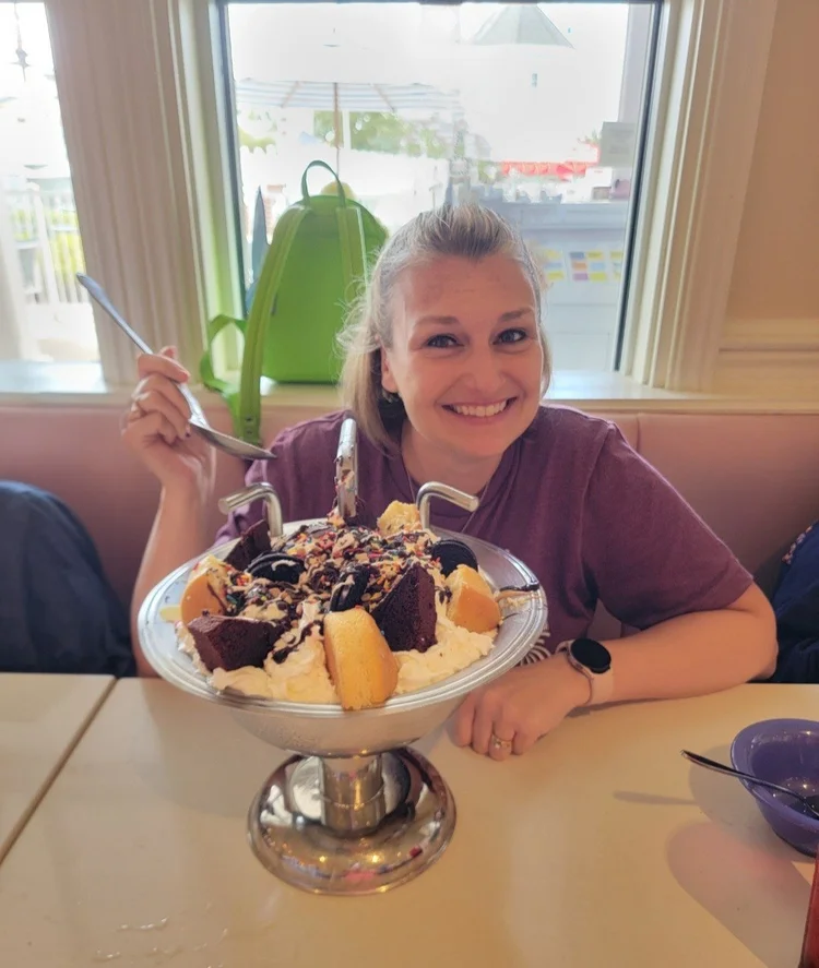 Kara Hull smiling behind a giant sundae