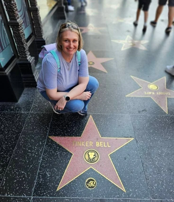 Kara Hull next to the Tinker Bell star on the Hollywood Walk of Fame
