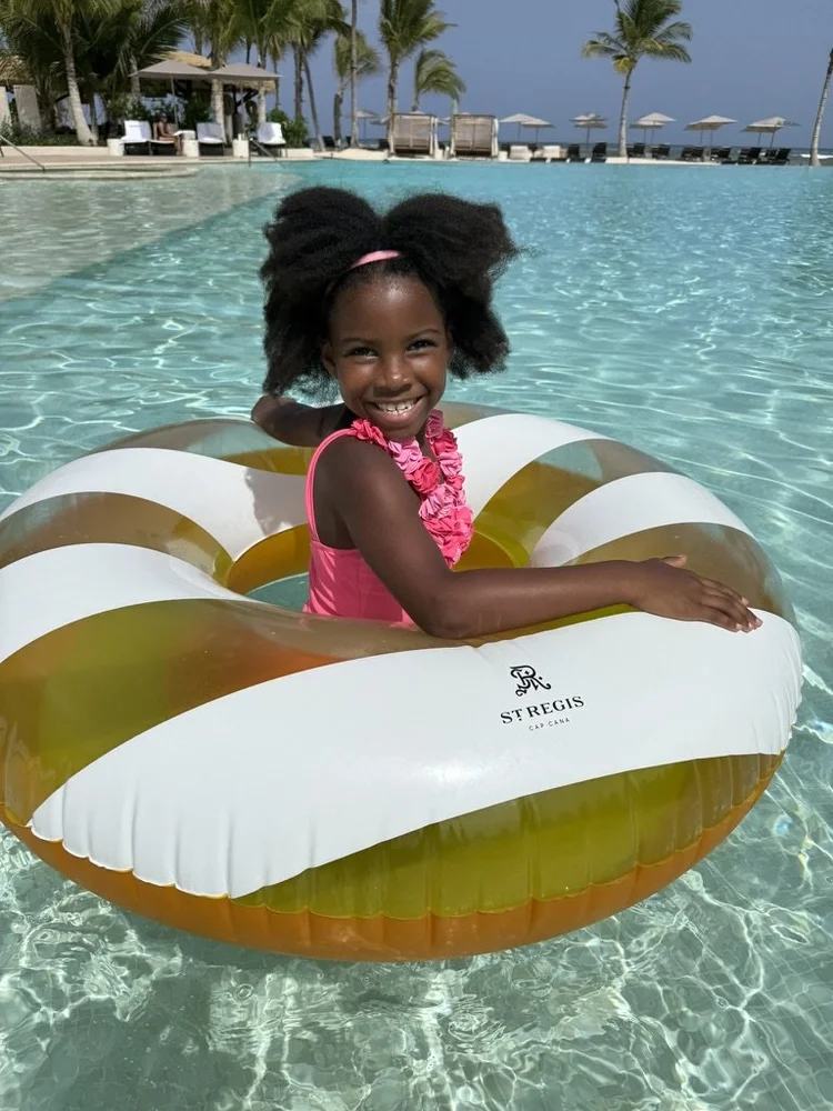 Piper Bryan in a pool float at the St. Regis Cap Cana