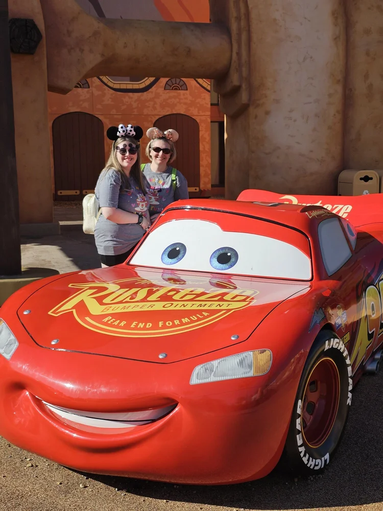 Kara Hull and her daughter with Lightning McQueen at Hollywood Studios