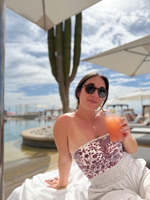 Alyssa LoVerso-Morgan with a cocktail poolside in Los Cabos