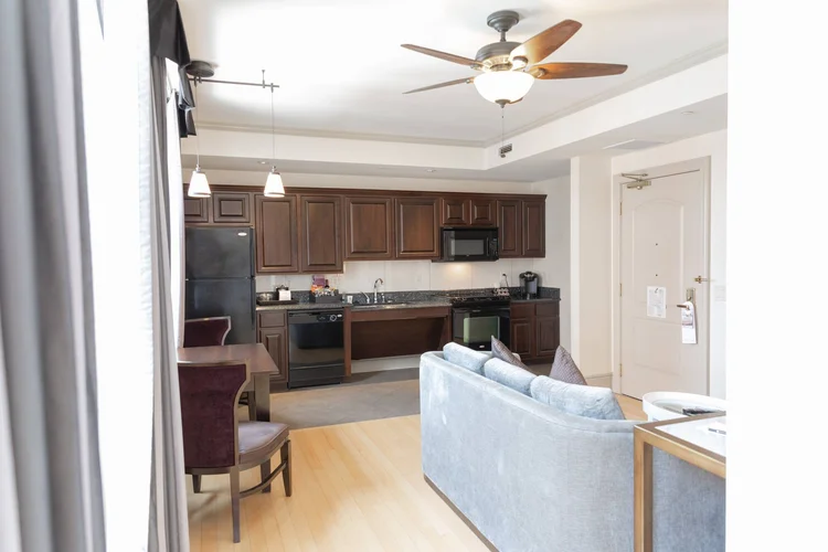 Suite kitchen with full-size appliances and a sofa