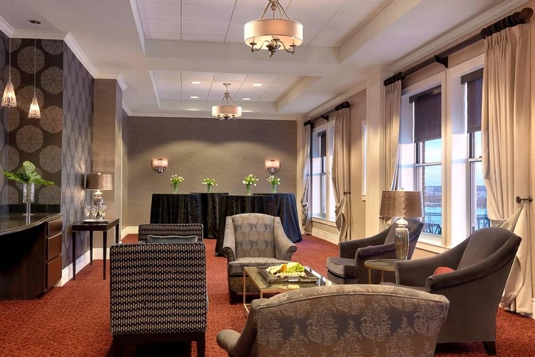 Club Davenport lounge with armchairs and a buffet