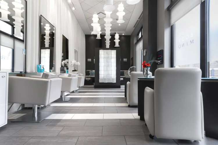 The Spa at Hotel Blackhawk salon with white chairs and pendant lights