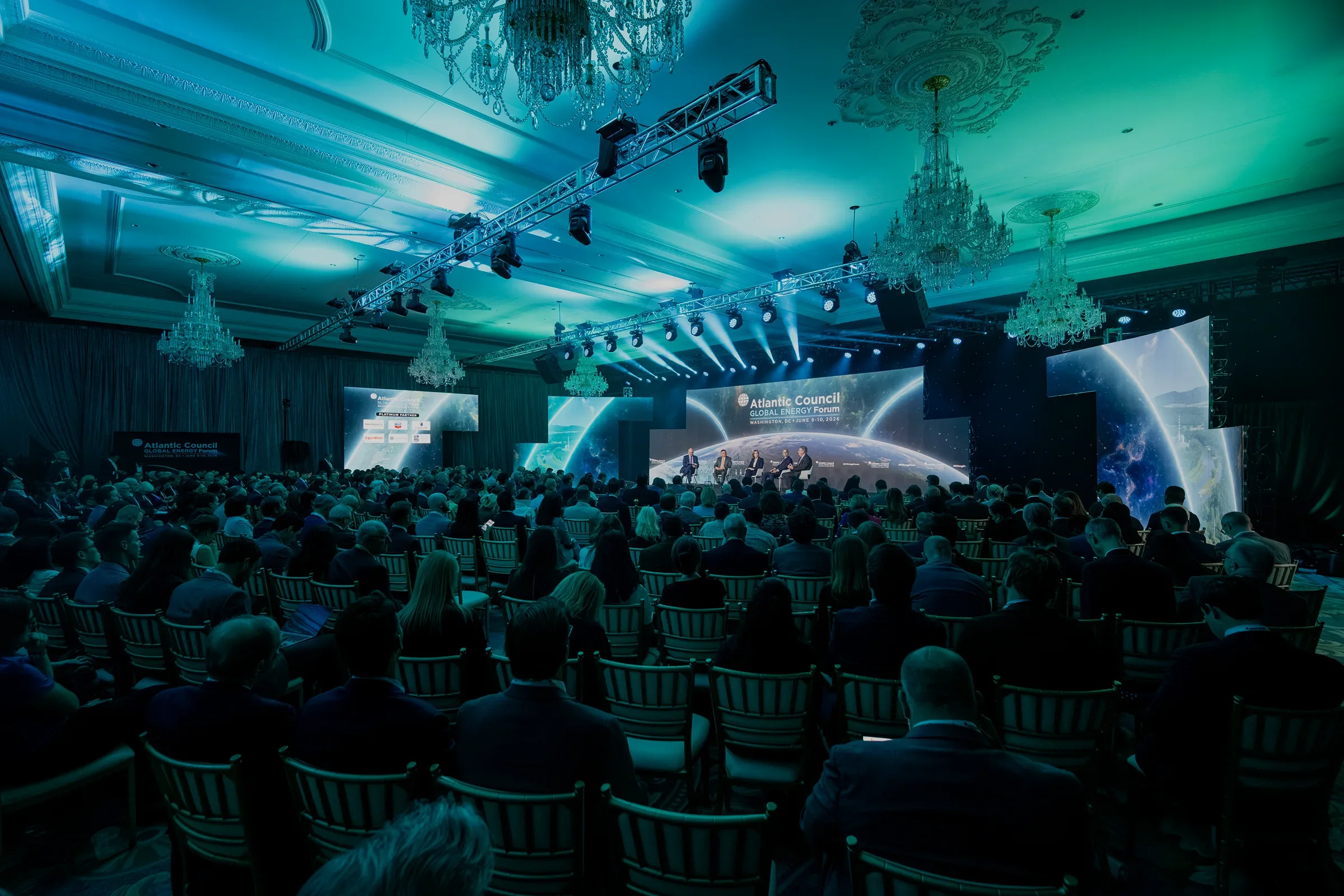 Completed Global Energy Forum event environment with large LED screens and stage
