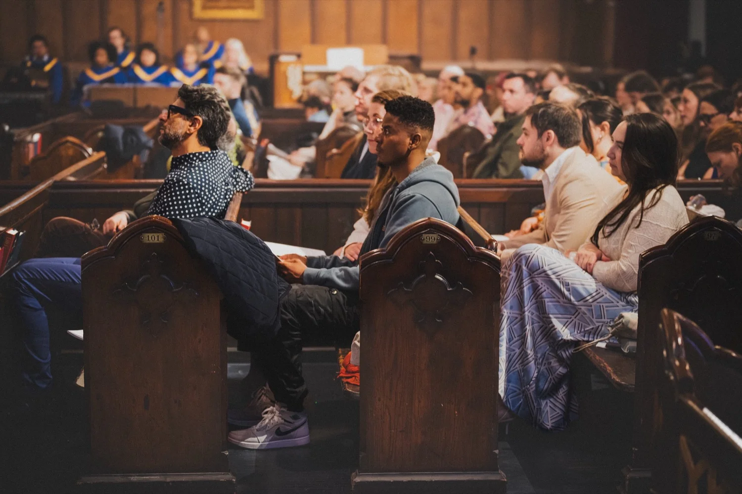 Friends side by side in the pews at St. John's