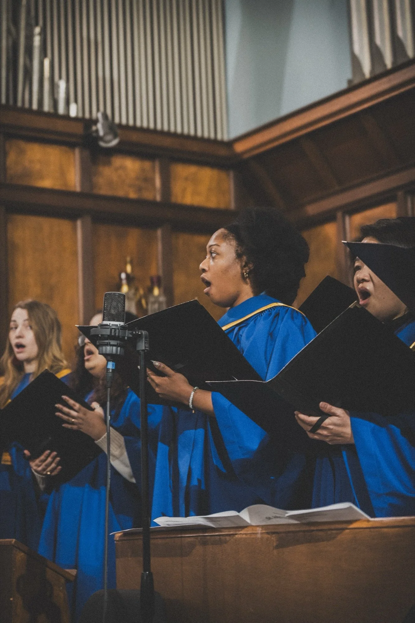 The St. John's choir singing in blue robes