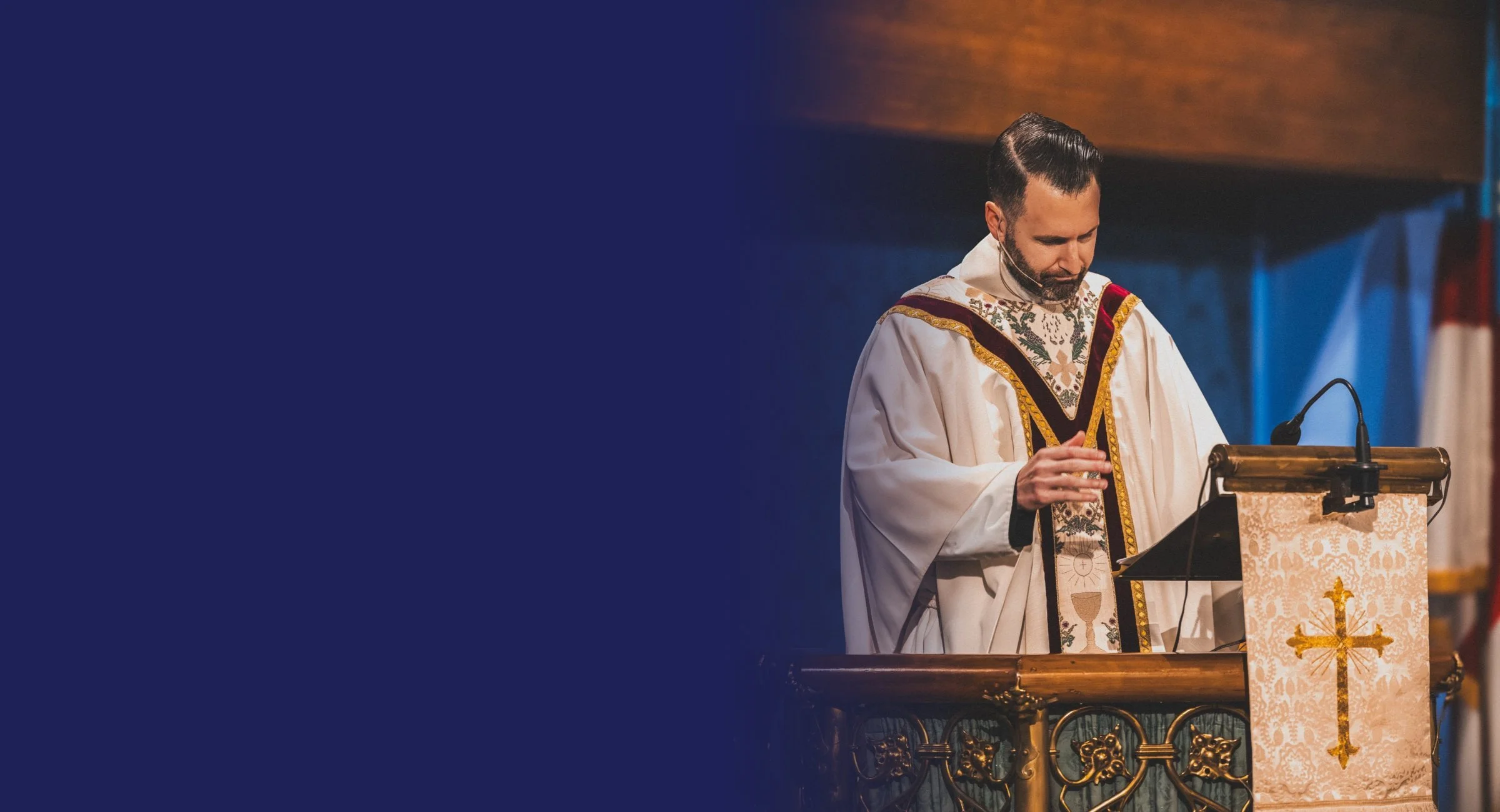 The Rev. Ben DeHart preaching from the pulpit at St. John's