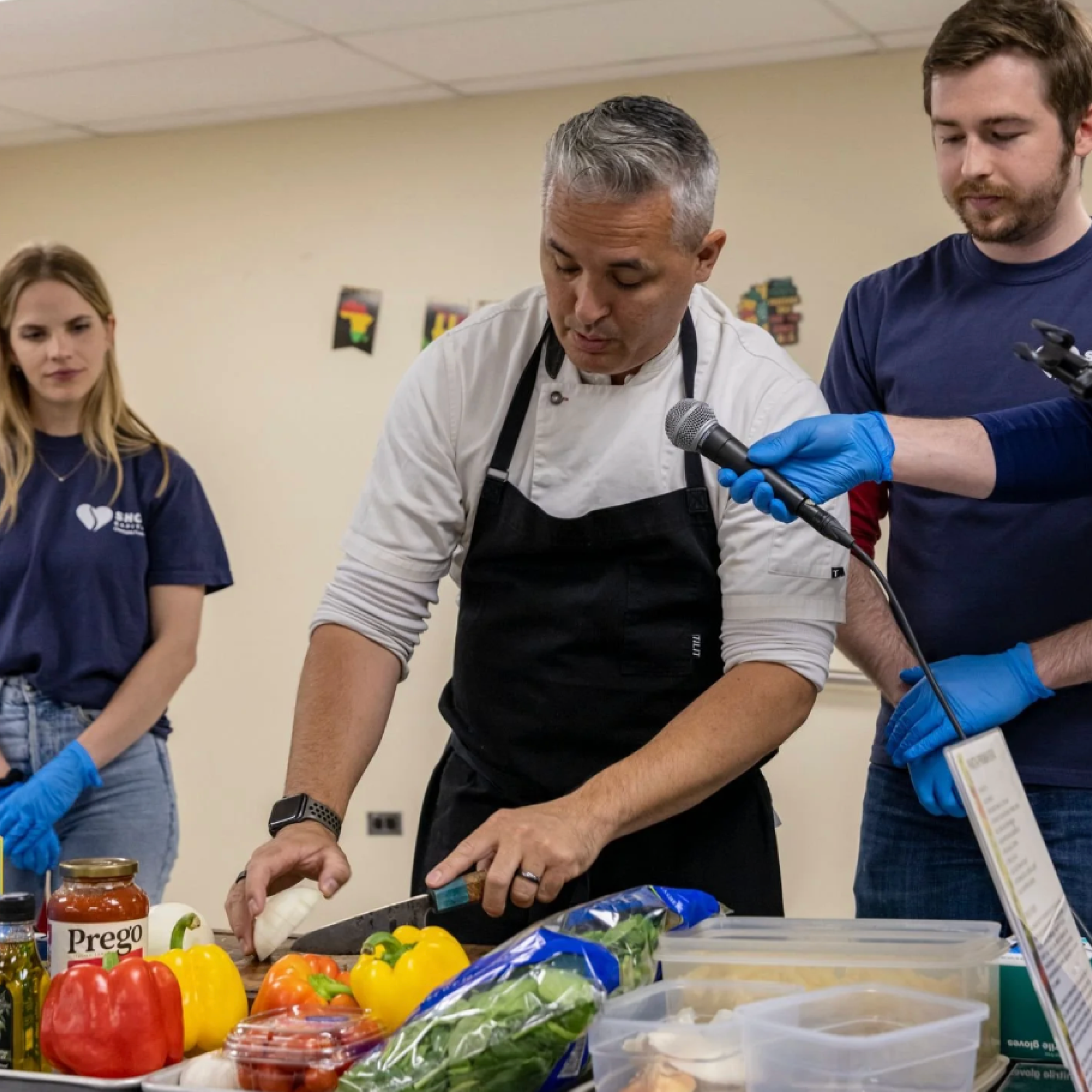 Chef Cory Morris hosts a cooking demonstration for seniors at a local senior center