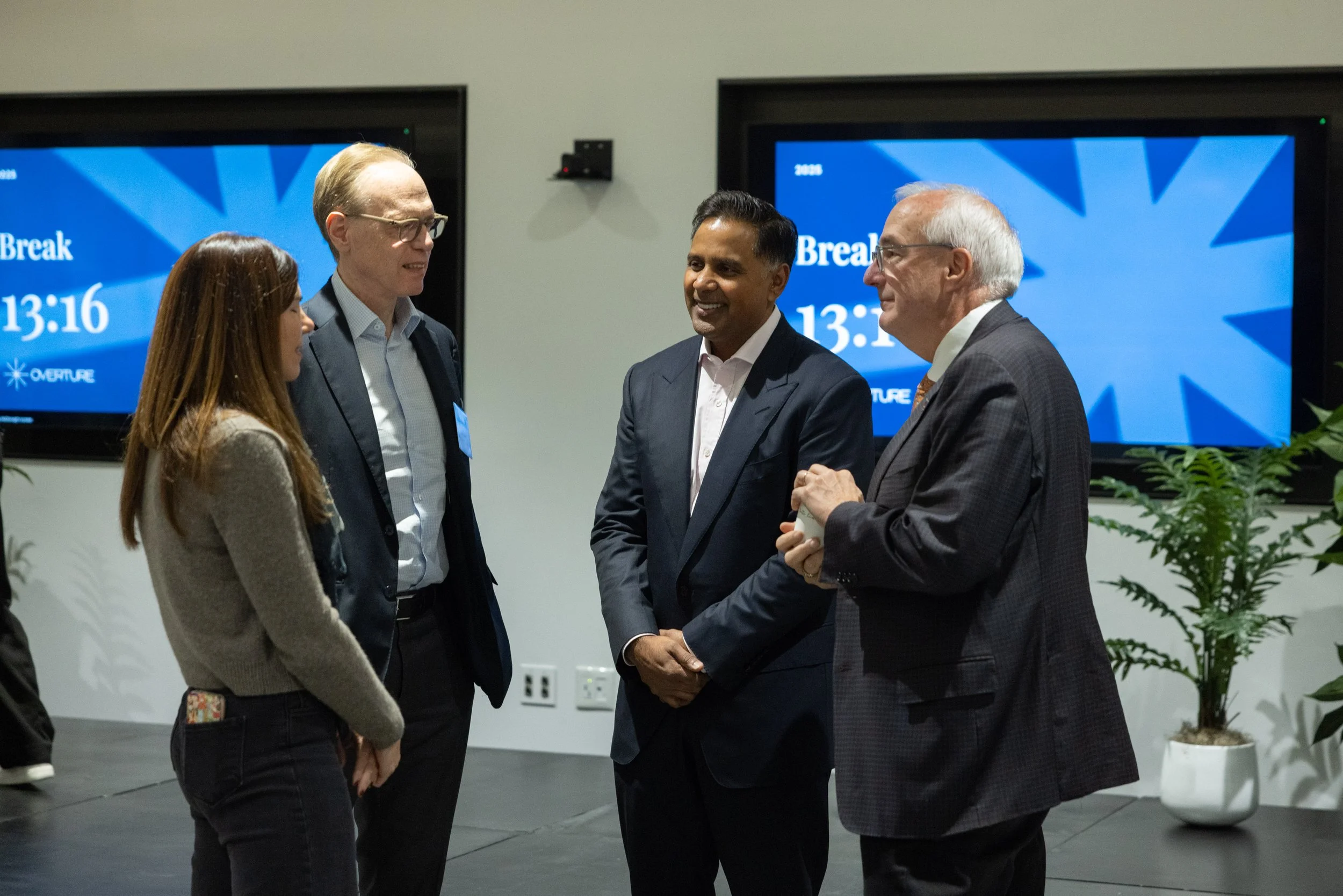 Attendees networking during a break at the 2025 Overture AGM