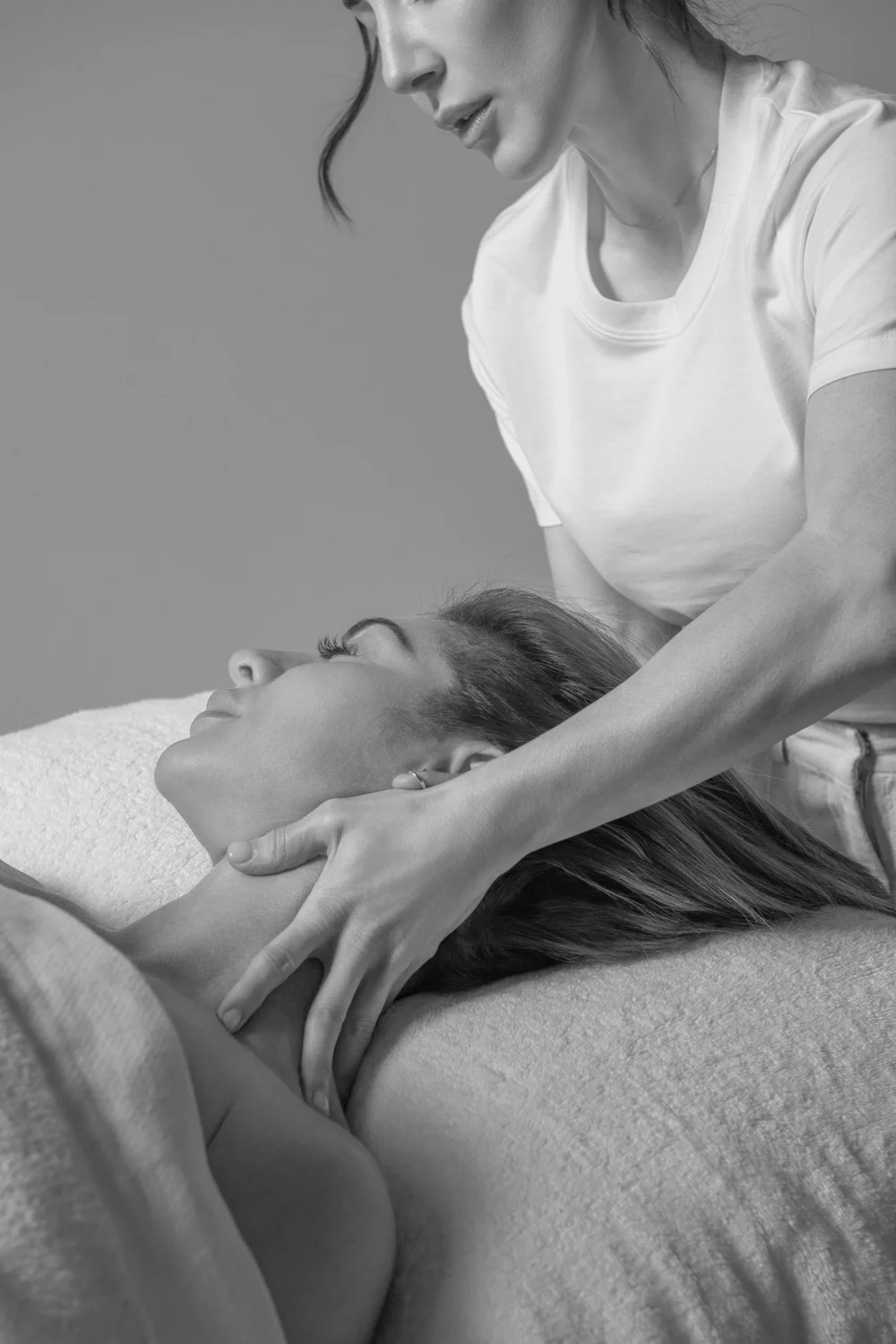 Violetta Zivkovic giving a neck and shoulder treatment