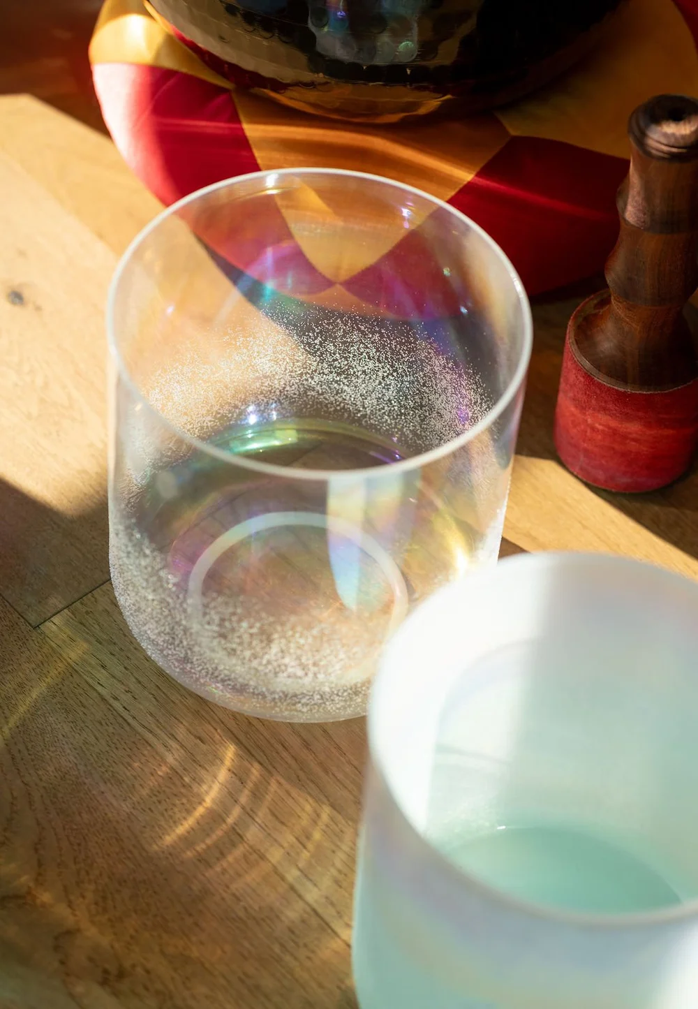 A crystal singing bowl catching the sun