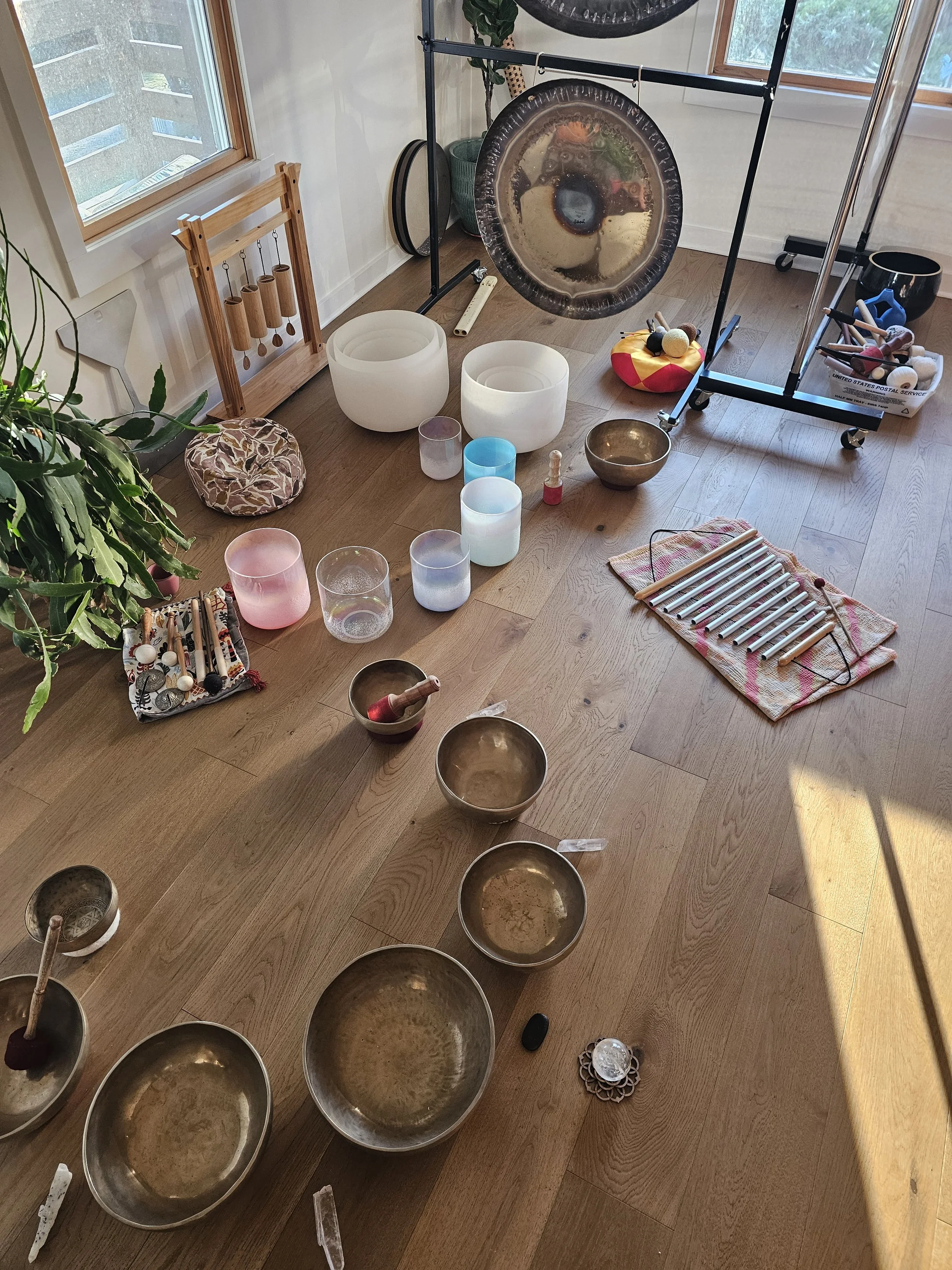Himalayan bowls and crystal bowls set in morning light before a ceremony