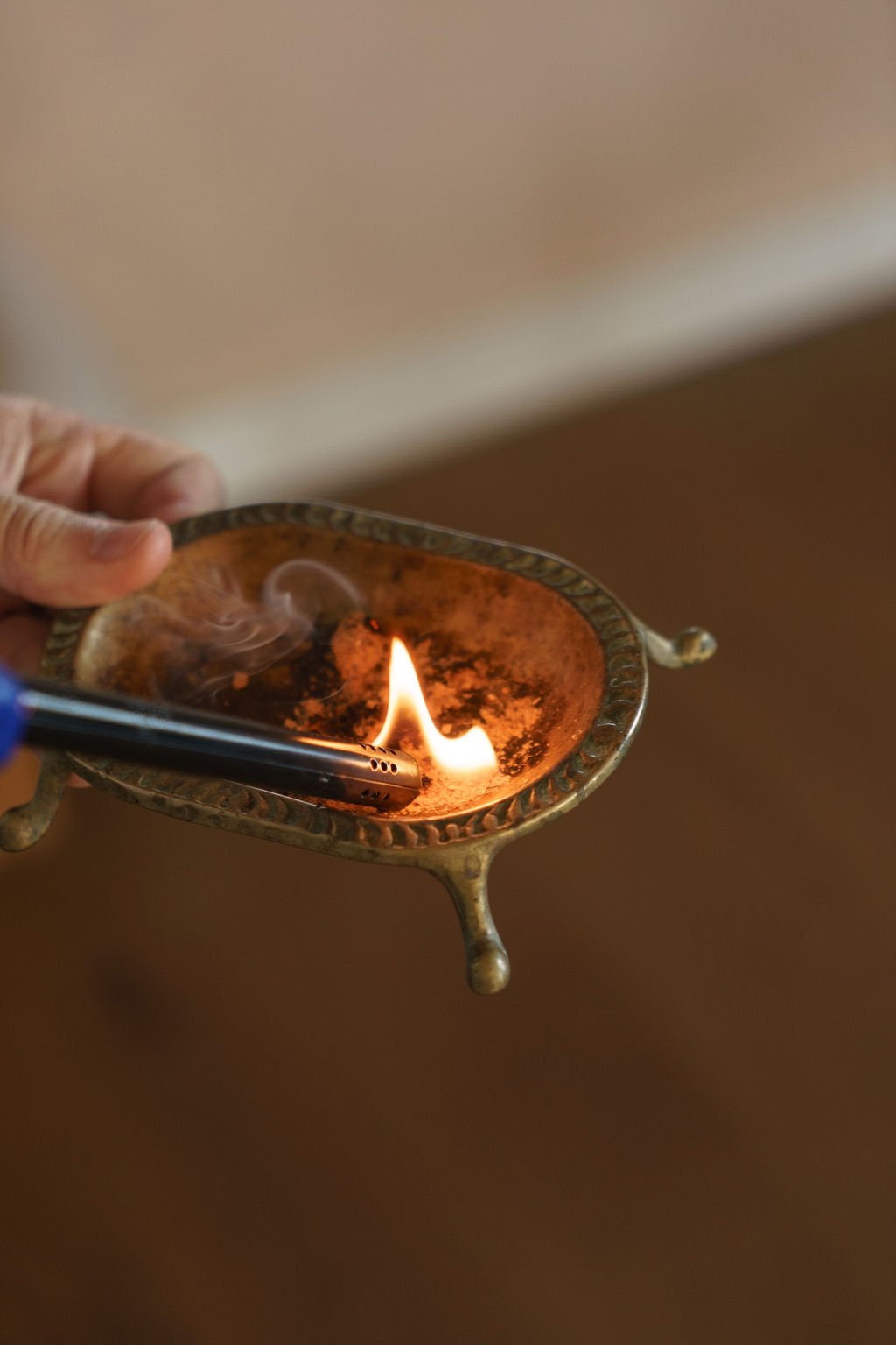 Smoke rising from a ceremonial vessel