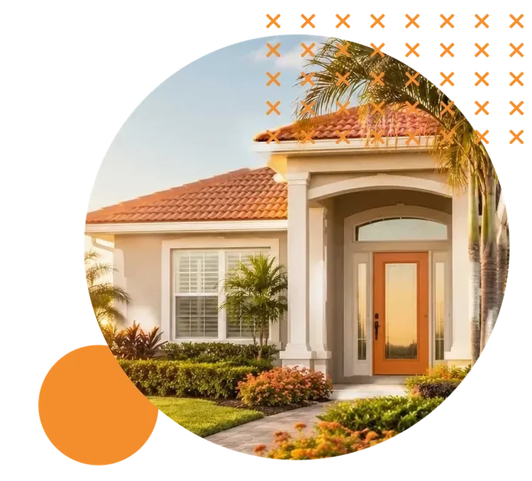 A single-story Florida home with a terracotta tile roof, an orange front door, and palm trees at sunset