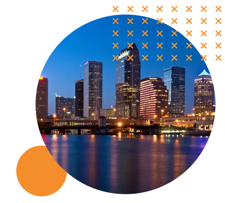 The downtown Tampa skyline at dusk, reflected in the Hillsborough River