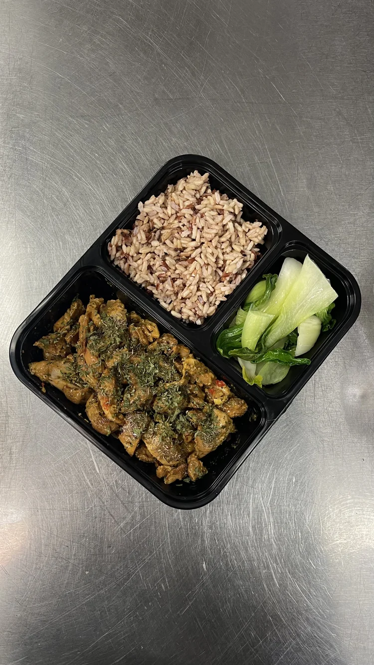 Herb roasted chicken with brown rice and bok choy, prepared fresh by Fit For You Guam