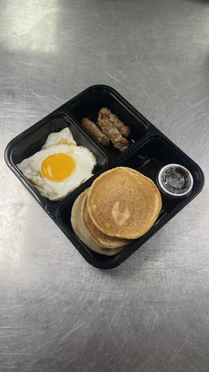Easy Eats breakfast plate with pancakes, a sunny-side-up egg and turkey sausage
