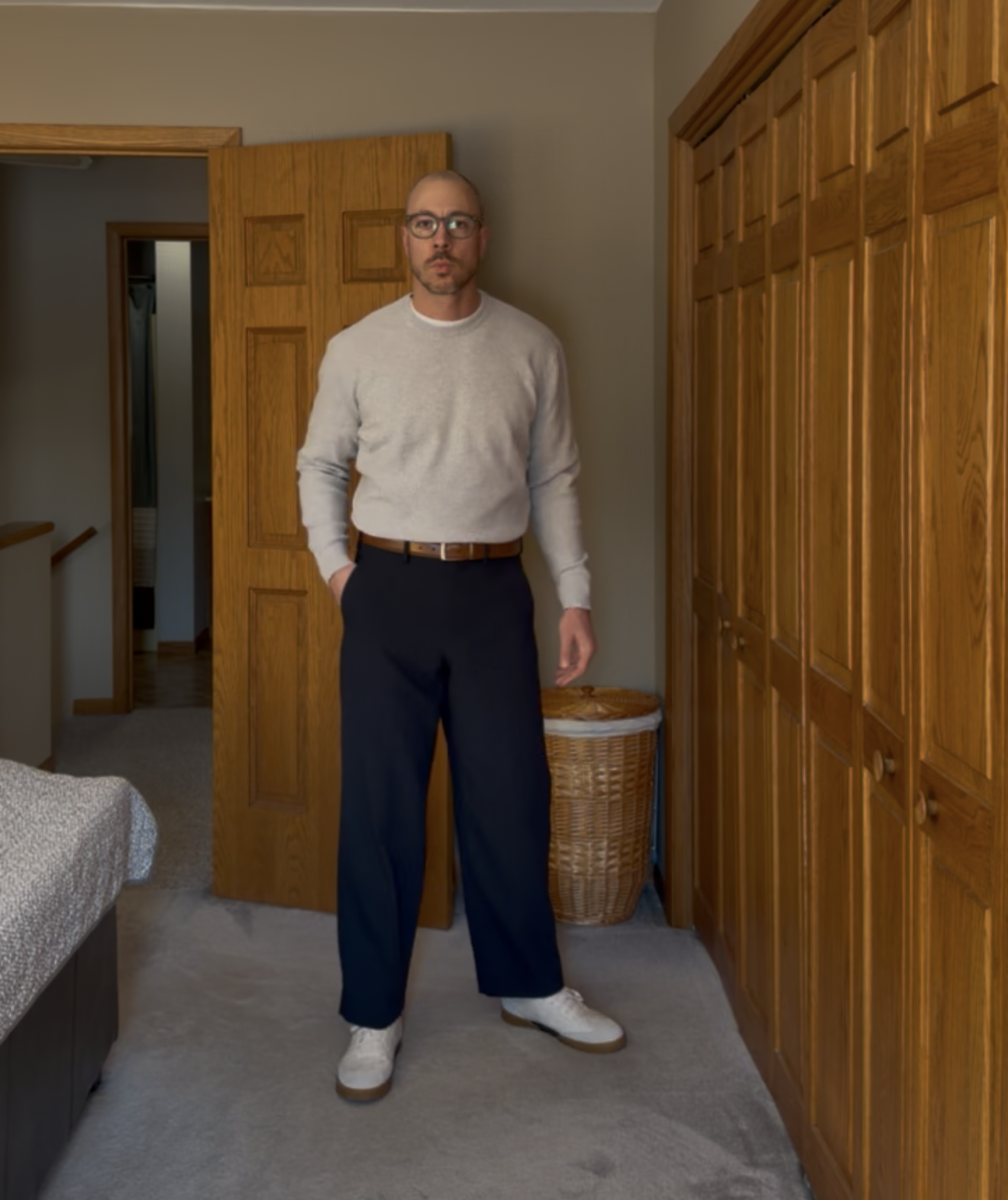 Gray knit with navy trousers and white sneakers