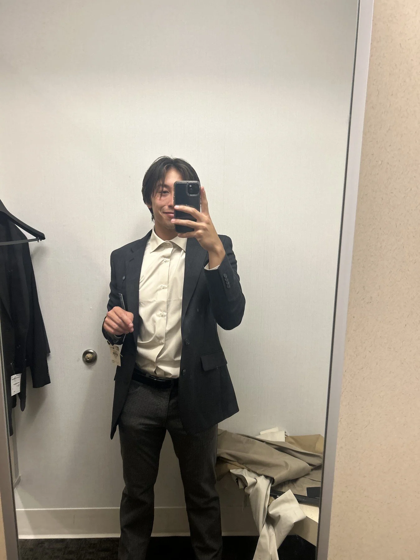 Dark blazer and white shirt with patterned trousers