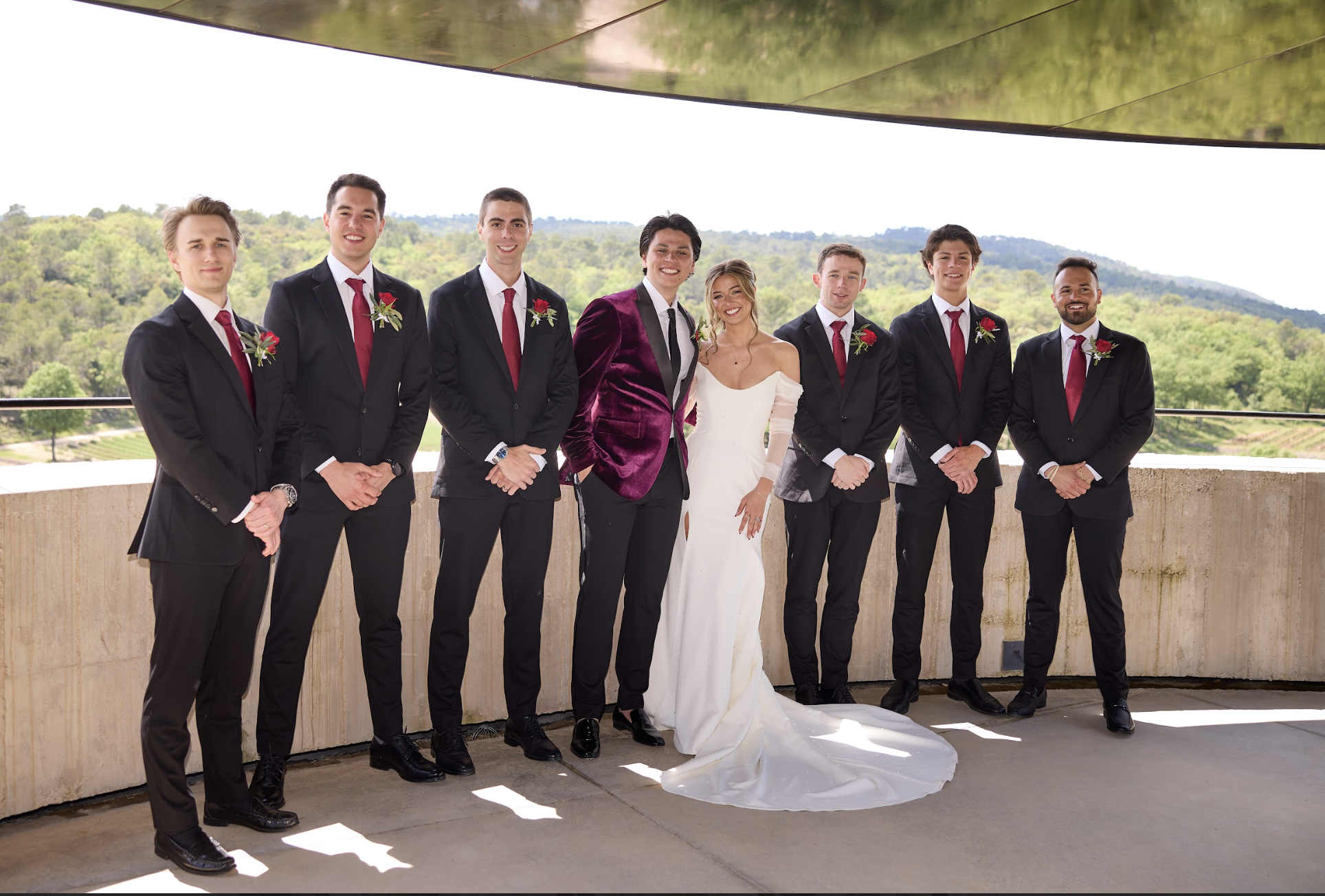 Wedding party in coordinated formalwear with the bride