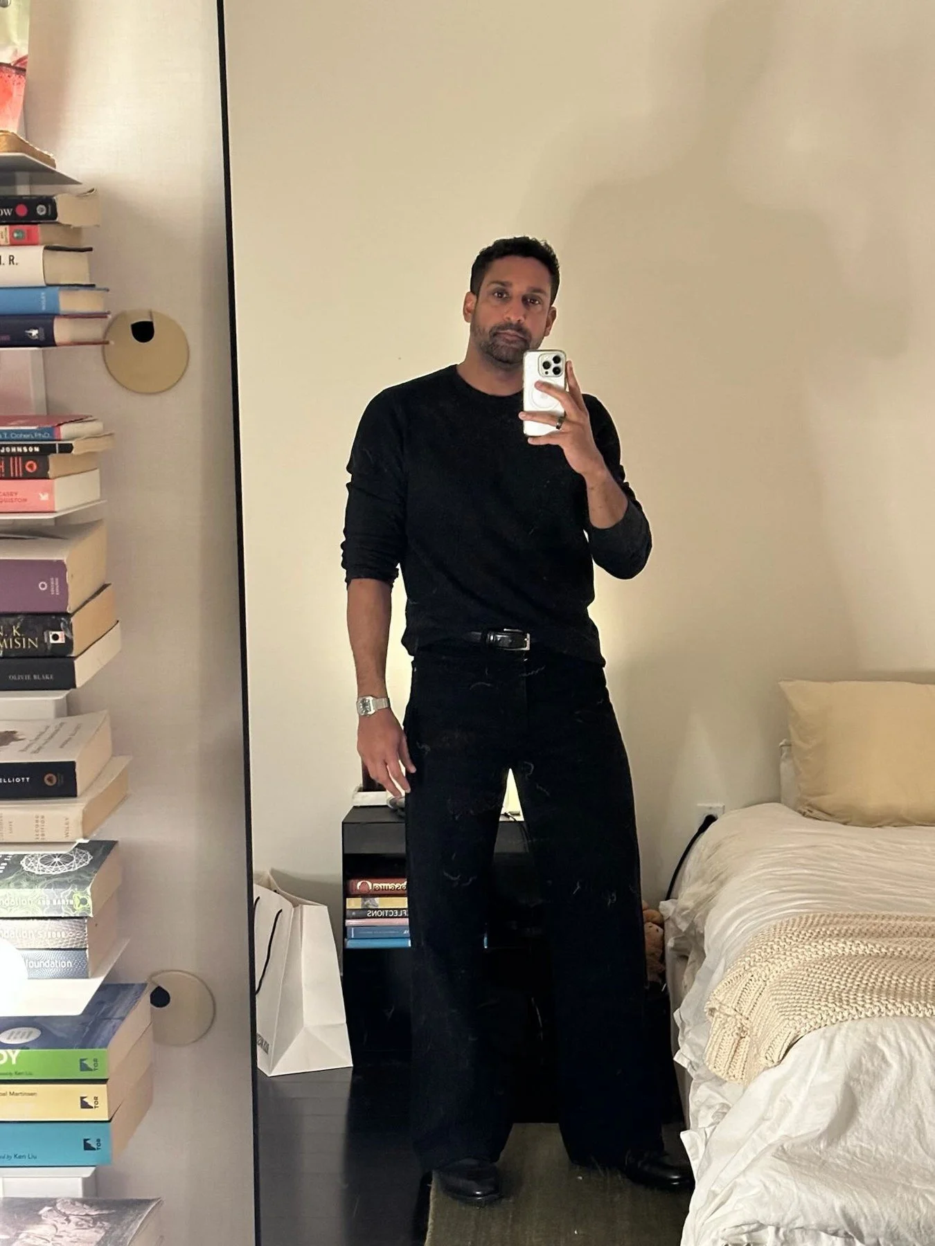 Real client mirror photo wearing an all-black outfit.
