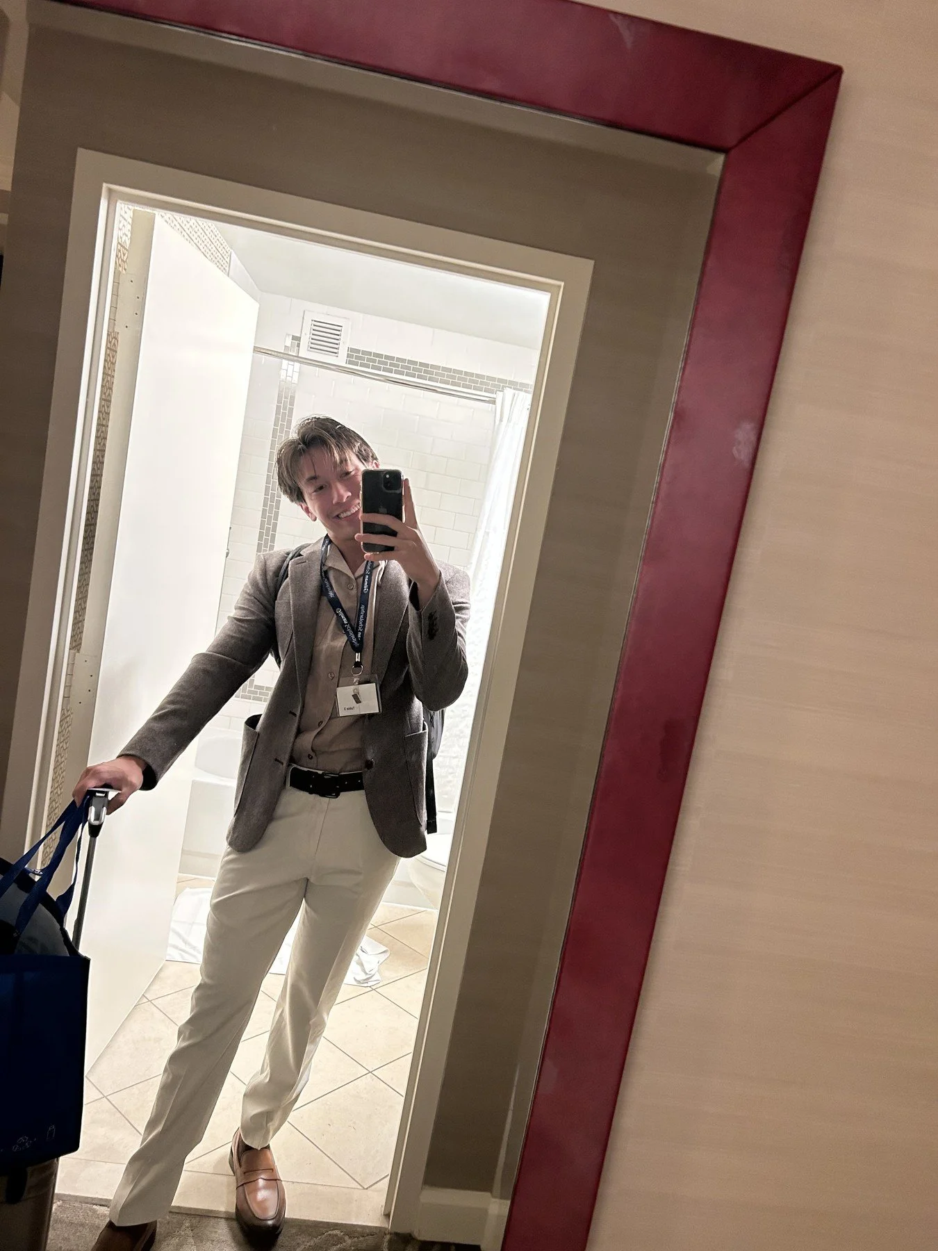 Brown blazer and cream trousers with loafers