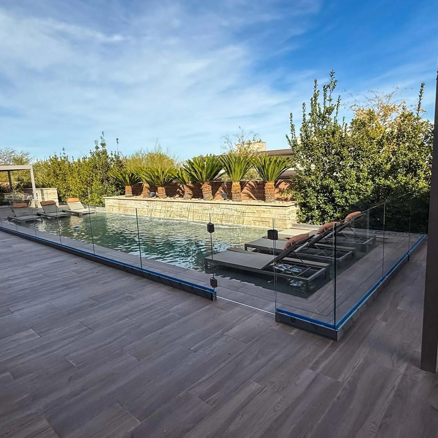 southwest pool with full-height glass enclosure