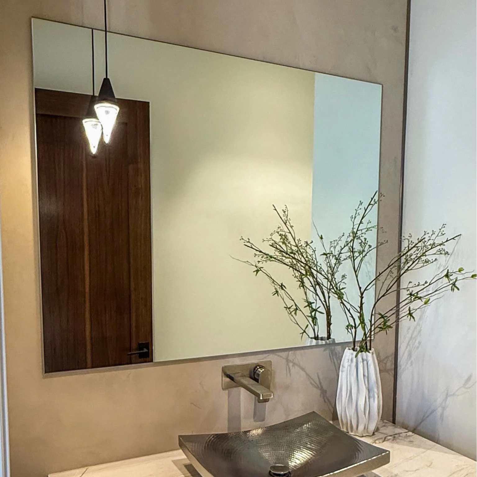 dining room with large mirrored wall panel